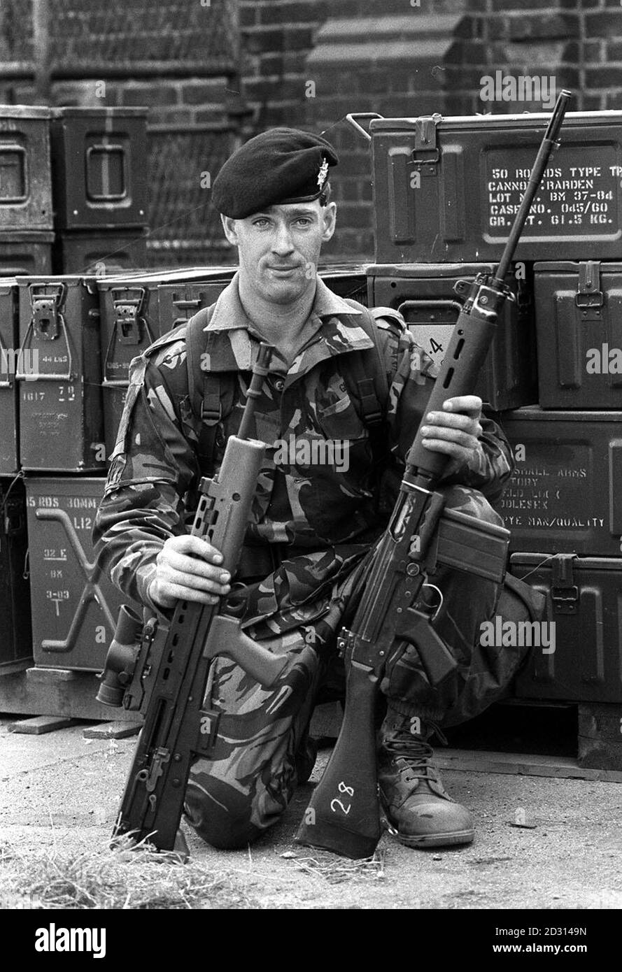 SA80 : Sgt Gary Gavin, 26, of the 1st Battalion Worcestershire and Sherwood Foresters Regiment, with the British Army's first fully automatic rifle, the Royal Ordnance Enfield Individual Rifle (SA80), left, and the weapon it will eventually replace, the Self Loading Rifle. * The first production batch was officially handed over today (2/10/85). Stock Photo