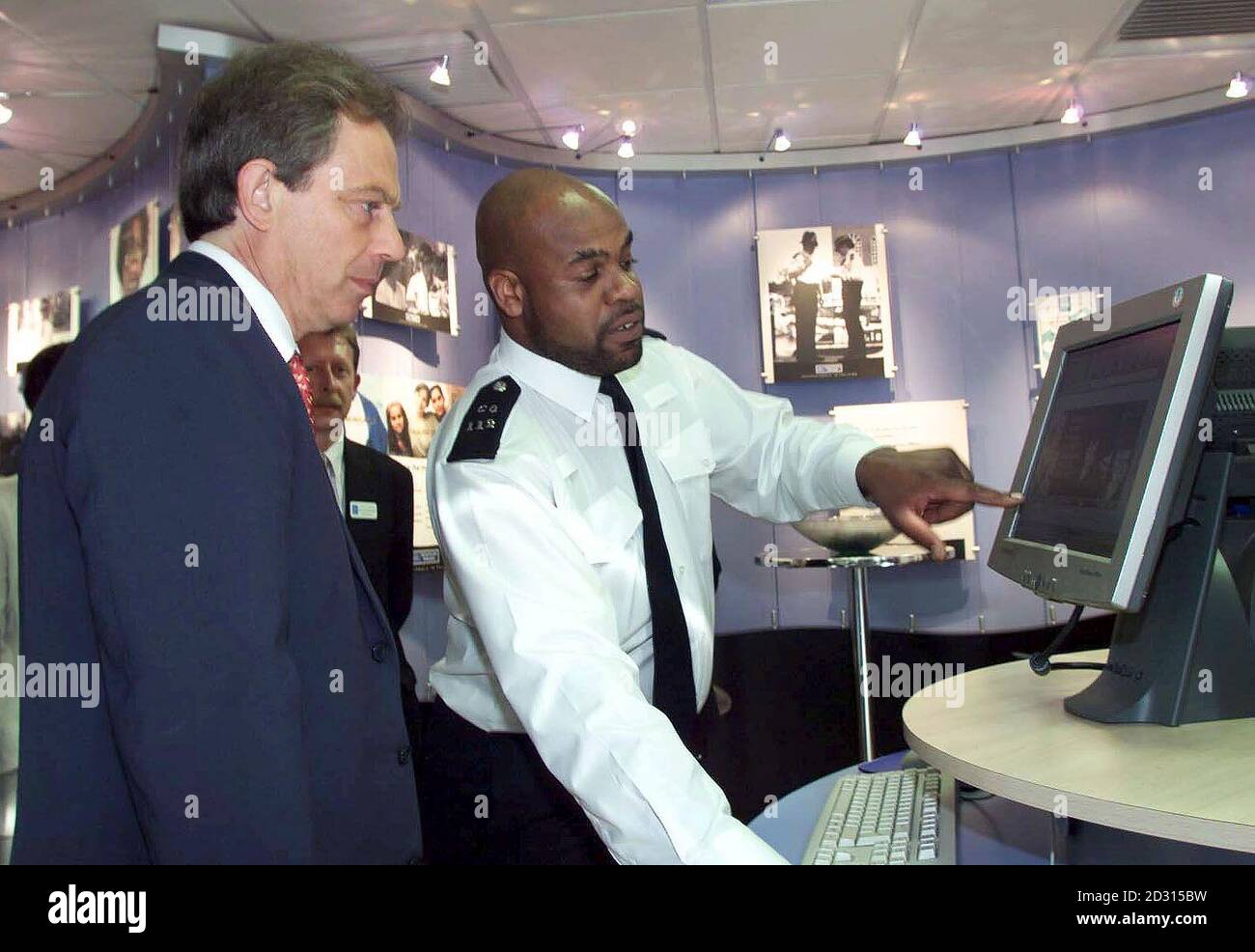 Britain's Prime Minister Tony Blair (left) launches a new Careers Office at Scotland Yard in London with constable Gamal Turawa who is part of the Positive Action Team.   *  Mr Blair spoke of the challenges facing officers in modern policing and stressed the Government was committed to rewarding them. Stock Photo