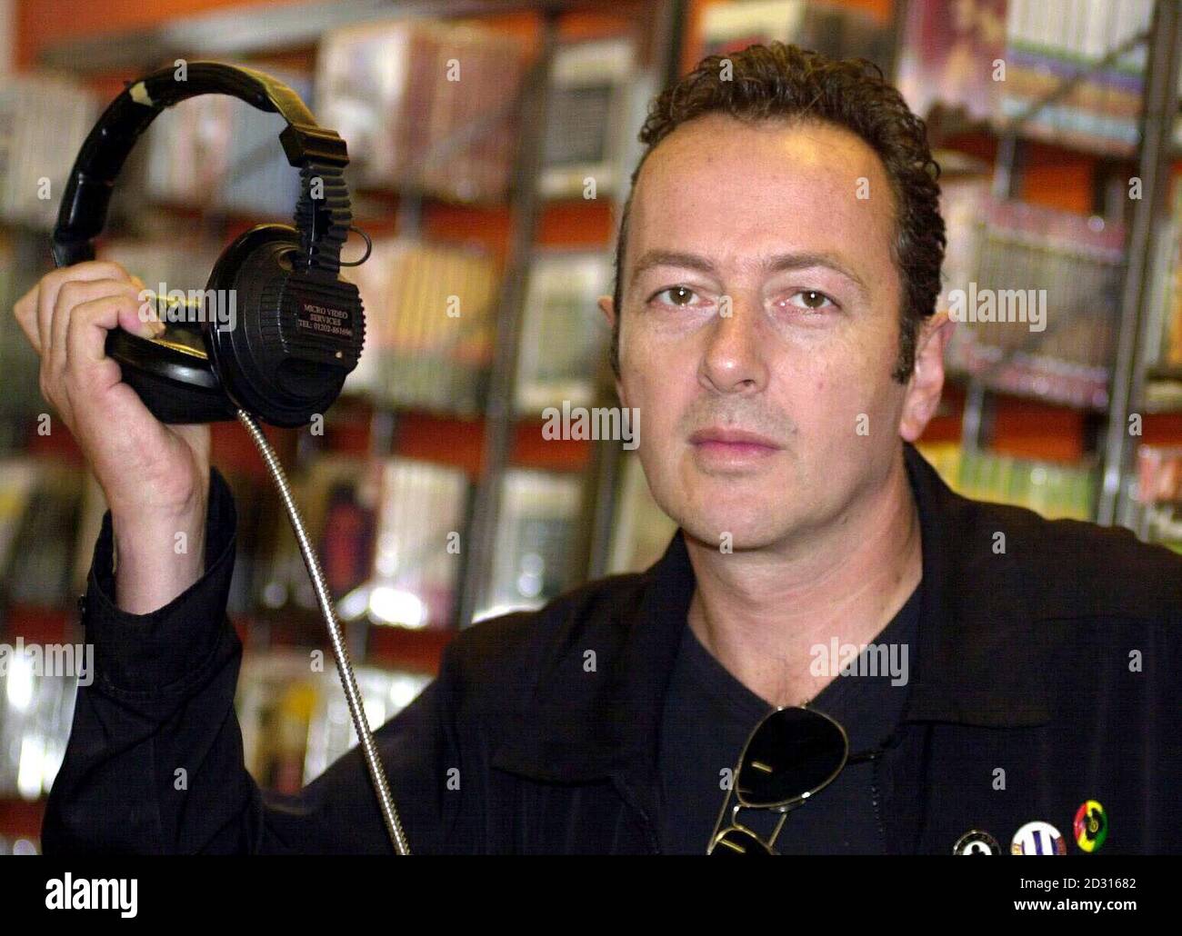 Former Clash frontman Joe Strummer, at Tower Records in Piccadilly, London, spearheading a celebrity team, to back a national organisation called Future Forests, whose aim is to plant trees to negate carbon emissions in the environment caused by cars, industry etc. Stock Photo