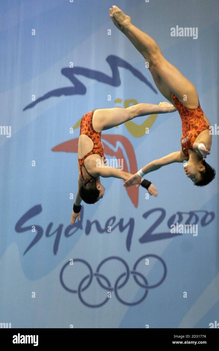 China's Na Li and Xue Sang compete in the Women's Synchronized 3m Springboard Final at the Olympic Games in Sydney. Na Li and Xue Sang won the Gold Medal in this event with a total score of 345.12. Stock Photo