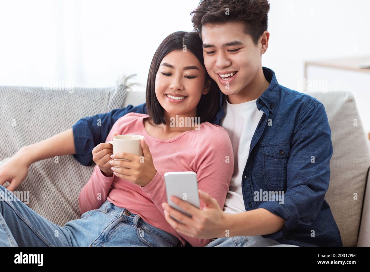 Korean couple on sofa hires stock photography and images Alamy