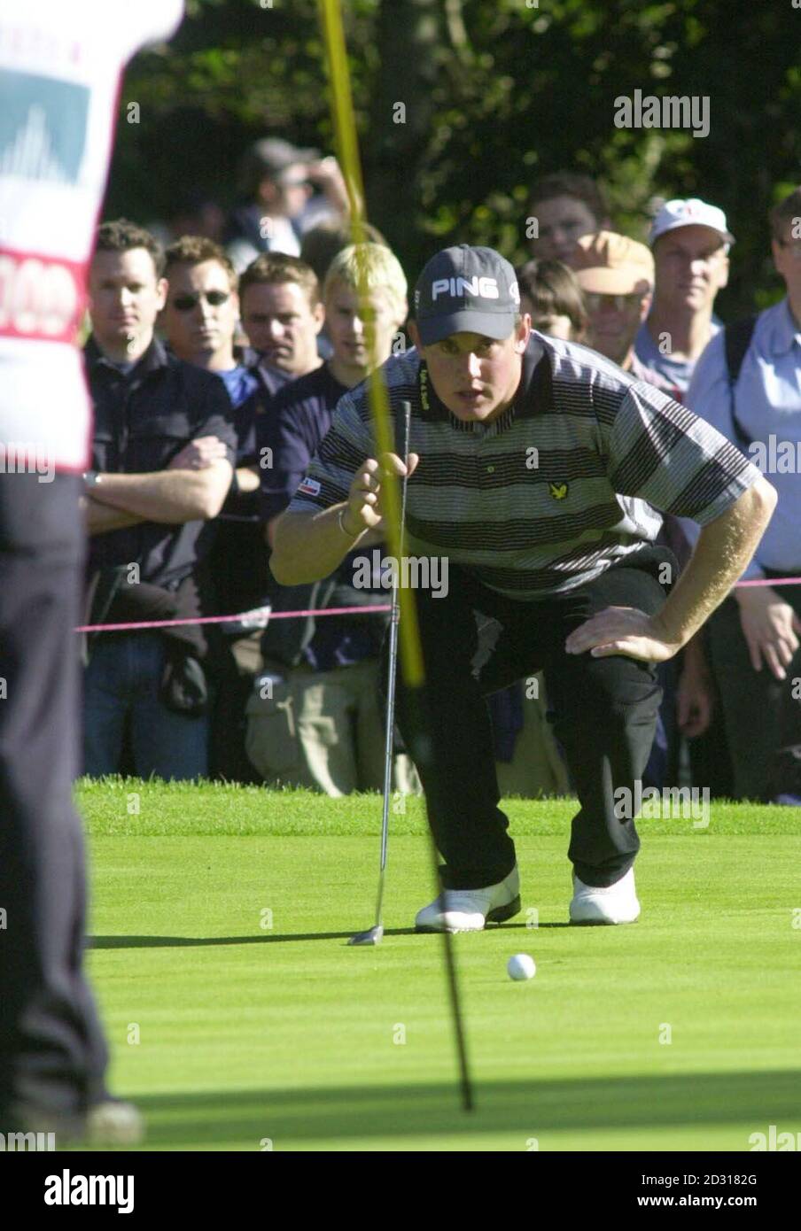Lee Westwood on the 4th green lines up his putt, during the final of the Cisco World Match Play Championship at Wentworth. Stock Photo