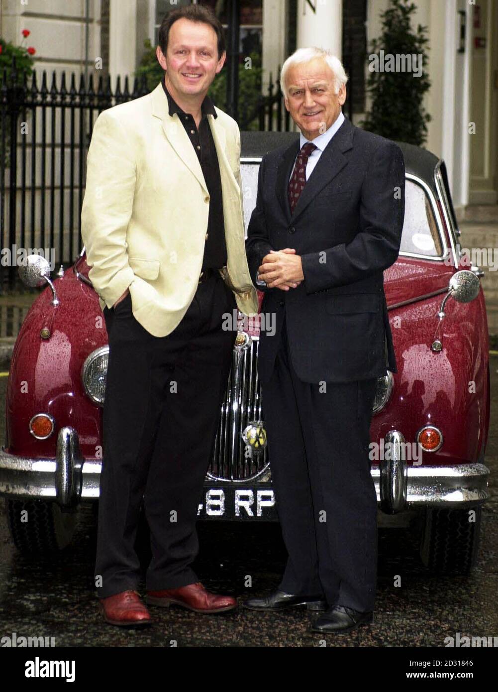 TV series Inspector Morse star John Thaw (right) and Kevin Whately, who plays Sgt Lewis, pose by Morse's Jaguar in St James's Square, central London,  before filming the last ever Inspector Morse. Stock Photo