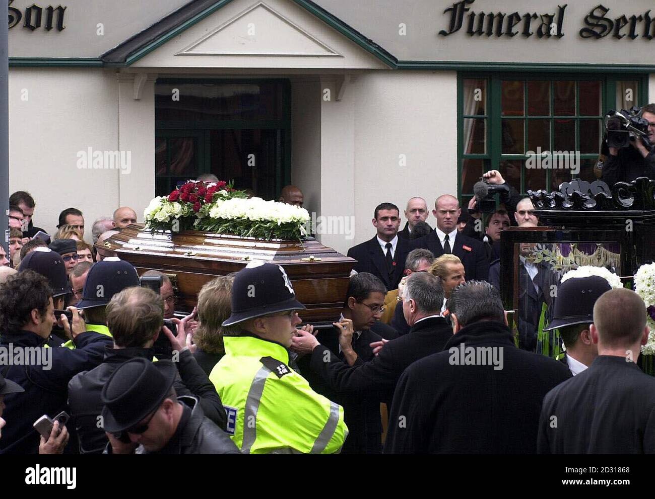 Reggie Kray's coffin leaving an undertaker in Bethnal Green. The gangland killer died a month after being freed from a life prison sentence on compassionate grounds and 10 days after leaving the Norfolk & Norwich hospital.   *  After a service at St Matthew's Church, Tower Hamlets, he will be buried in the family plot at Chingford Mount Cemetery alongside his brother Ronnie and Charlie.  The Krays' gang, The Firm, had a Mafia-style grip on London's East End in the 1960s. Stock Photo