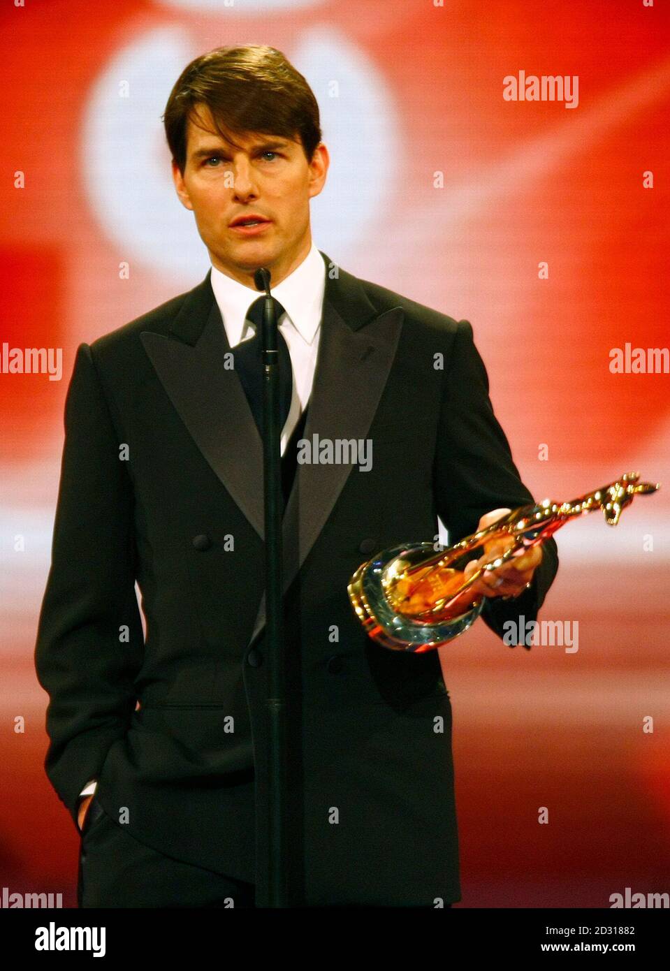 U.S. actor Tom Cruise holds his Bambi media award as he makes an acceptance  speech during the 59th Bambi ceremony in the western German city of  Duesseldorf November 29, 2007. Each year,