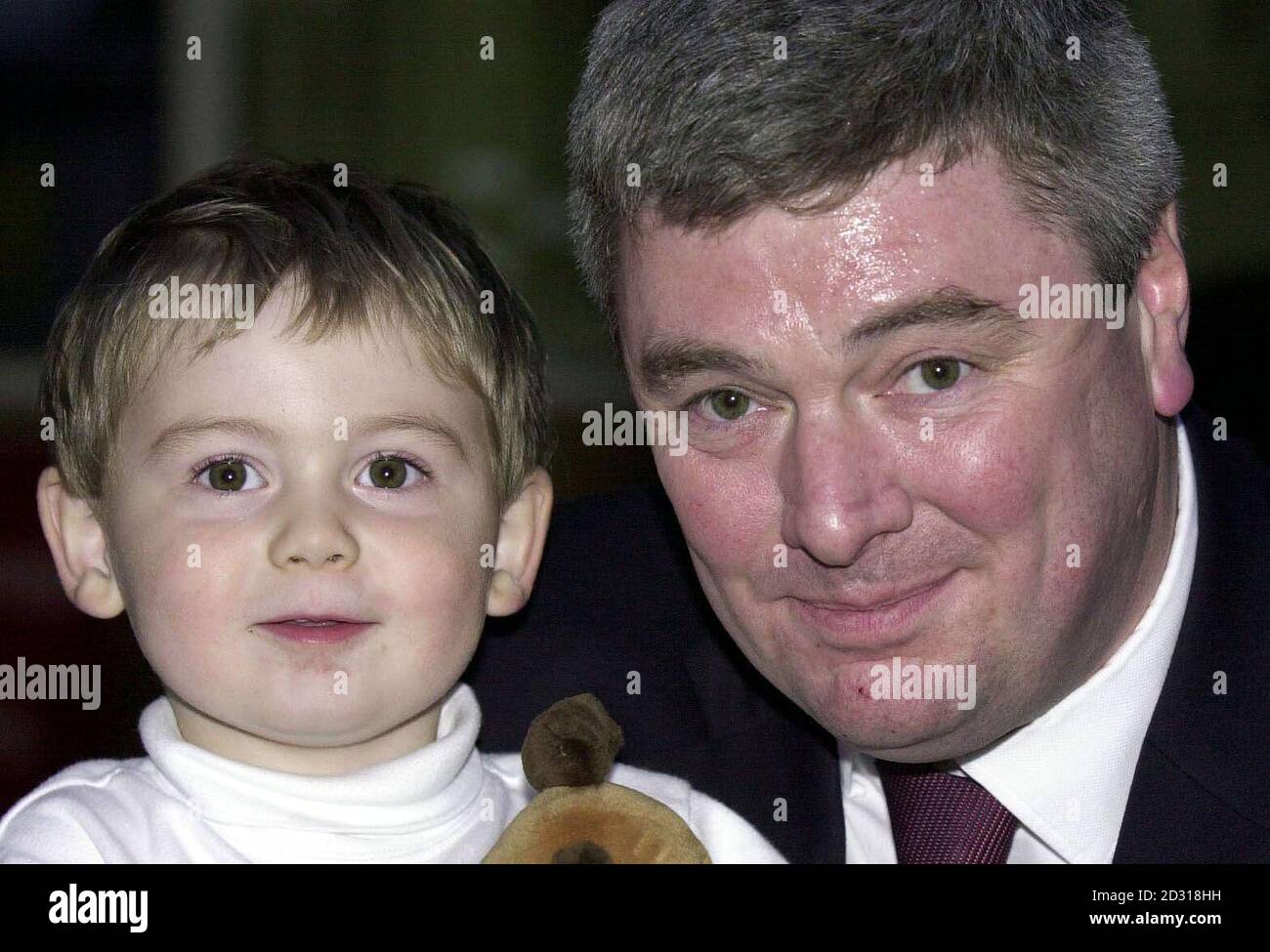 Mr Peter Moore and his son Charlie, two, from Newark, Notts, at the Queen Elizabeth Hospital in Welwyn Garden City. They were visiting Mr Moore's wife, Karen, who was a passenger on the Kings Cross to Leeds train which derailed killing at least four people.   *... Emergency services at the scene reported 80 walking wounded after part of the eight coach GNER train came off the line. Mrs Moore is being treated for cuts and bruises.    Stock Photo