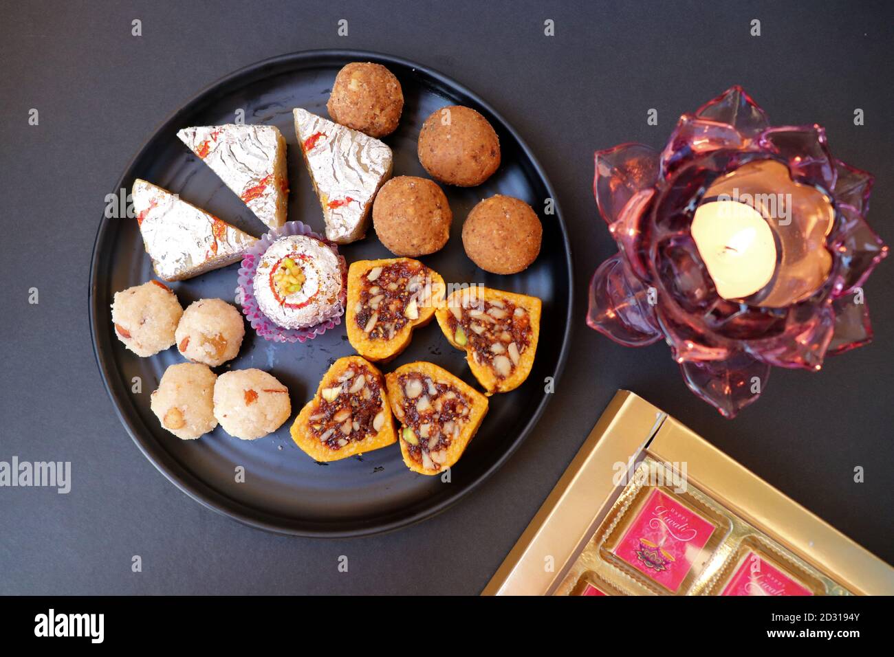 Assorted Indian sweets or Mithai, Rava laddoo, Besan laddu, dry fruits ...