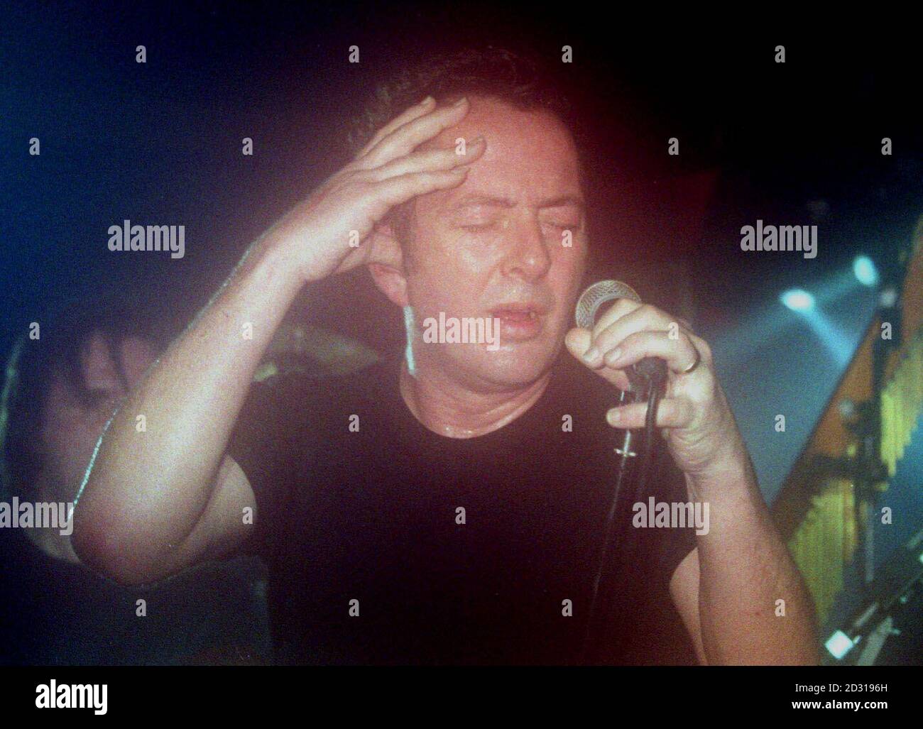 Joe Strummer, formerly of the rock group The Clash, performing at the launch of the Q awards at the 100 club, London Stock Photo