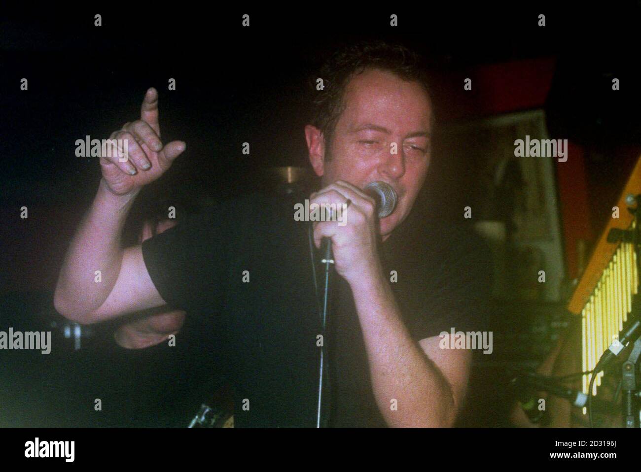 Joe Strummer, formerly of the rock group The Clash, performing at the launch of the Q awards at the 100 club, London Stock Photo