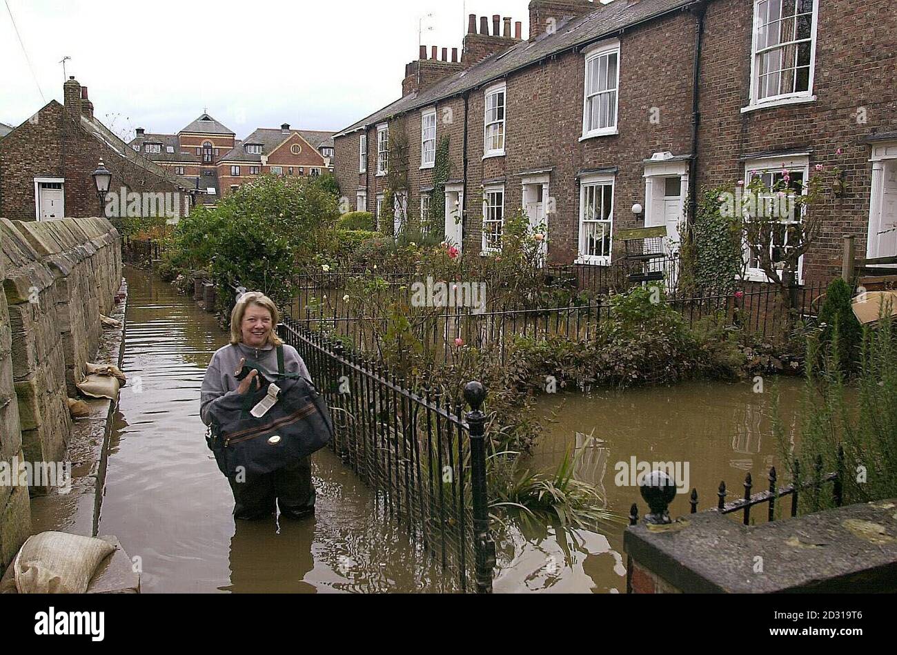 A resident returns to her home in Tower Place, York, from the temporary accommodation she has been living in whilst her home has been flooded after heavy rains over the past ten days, to collect some more work clothes. * The Environment Agency said conditions overall are set to improve over the next few days, although there may be slight worsening in north east England and York. Insurance giant Royal & Sun Alliance said the adverse weather in the UK and Europe was likely to cost it between 80 million and 110 million. Stock Photo
