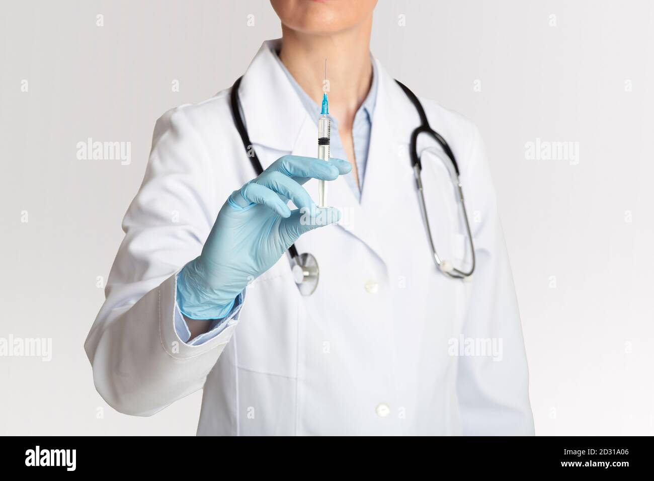 Health care, treatment and injection against coronavirus. Woman doctor holds syringe for vaccination Stock Photo
