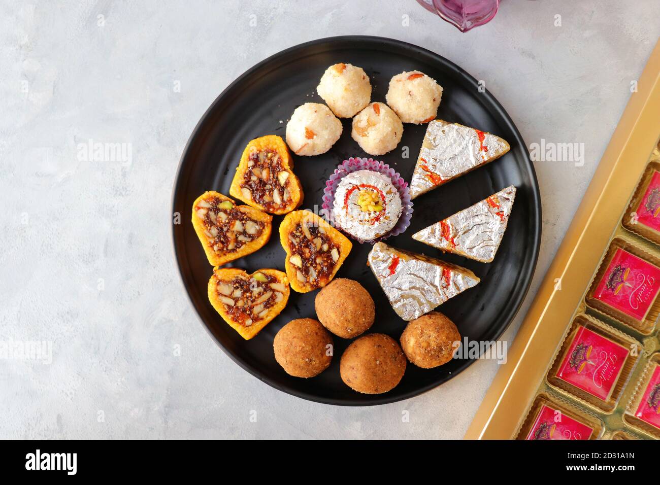 Assorted Indian sweets or Mithai, Rava laddoo, Besan laddu, dry fruits ...