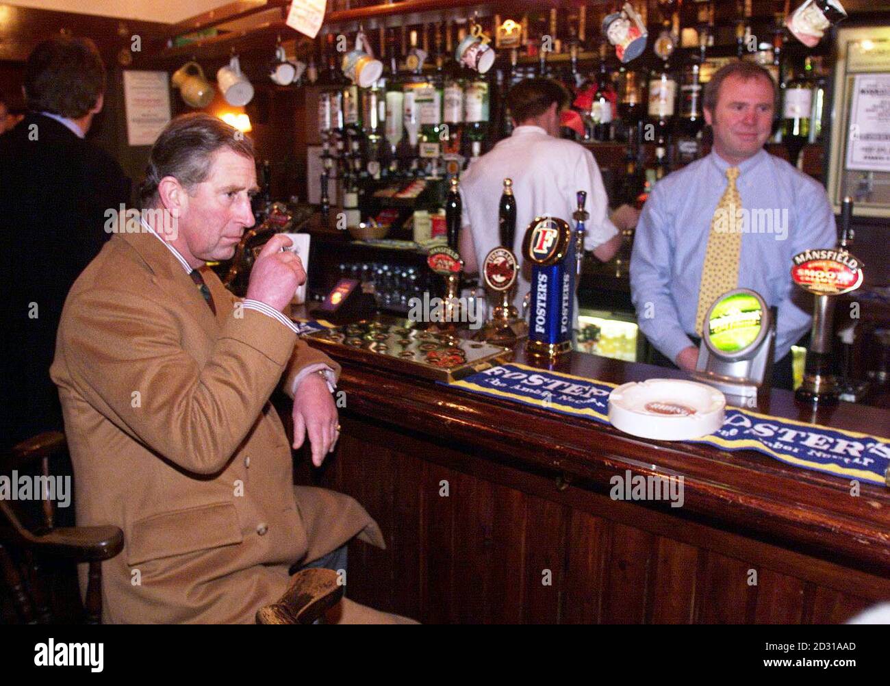 The Prince of Wales enjoys a whisky in the Blacksmith's pub in Naburn, Yorkshire, as he talks to residents about the recent flooding in the town. The Prince visited the city of Barlby where he met residents who had to evacuate their homes. * when the River Ouse burst its banks. Stock Photo