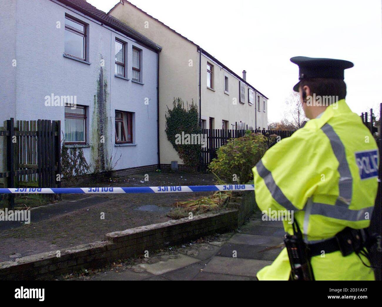 A policeman at the scene in the Springfarm estate, Antrim after the body of an 18-year-old man was found at around 1.25am.  The Royal Ulster Constabulary have launched a murder hunt.  *... and detectives investigating the killing appealed to anyone in the area who heard or saw anything suspicious in the area around Flat 6a last night or early this morning. Stock Photo