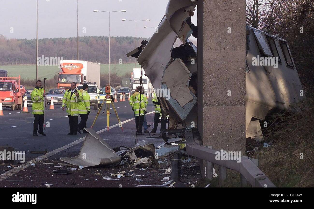 Police officers at the scene where one person was killed and two seriously injured when a prison van collided with two other vehicles at junction 27 of the M6. The female driver of the van was trapped and was cut free by firefighters.  *... before being taken to hospital by air ambulance. The police said they were still not sure whether the dead man was a prison officer or a prisoner. Stock Photo