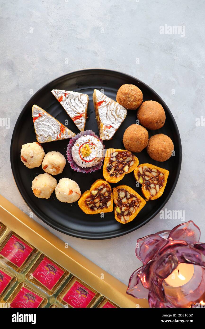 Assorted Indian sweets or Mithai, Rava laddoo, Besan laddu, dry fruits ...