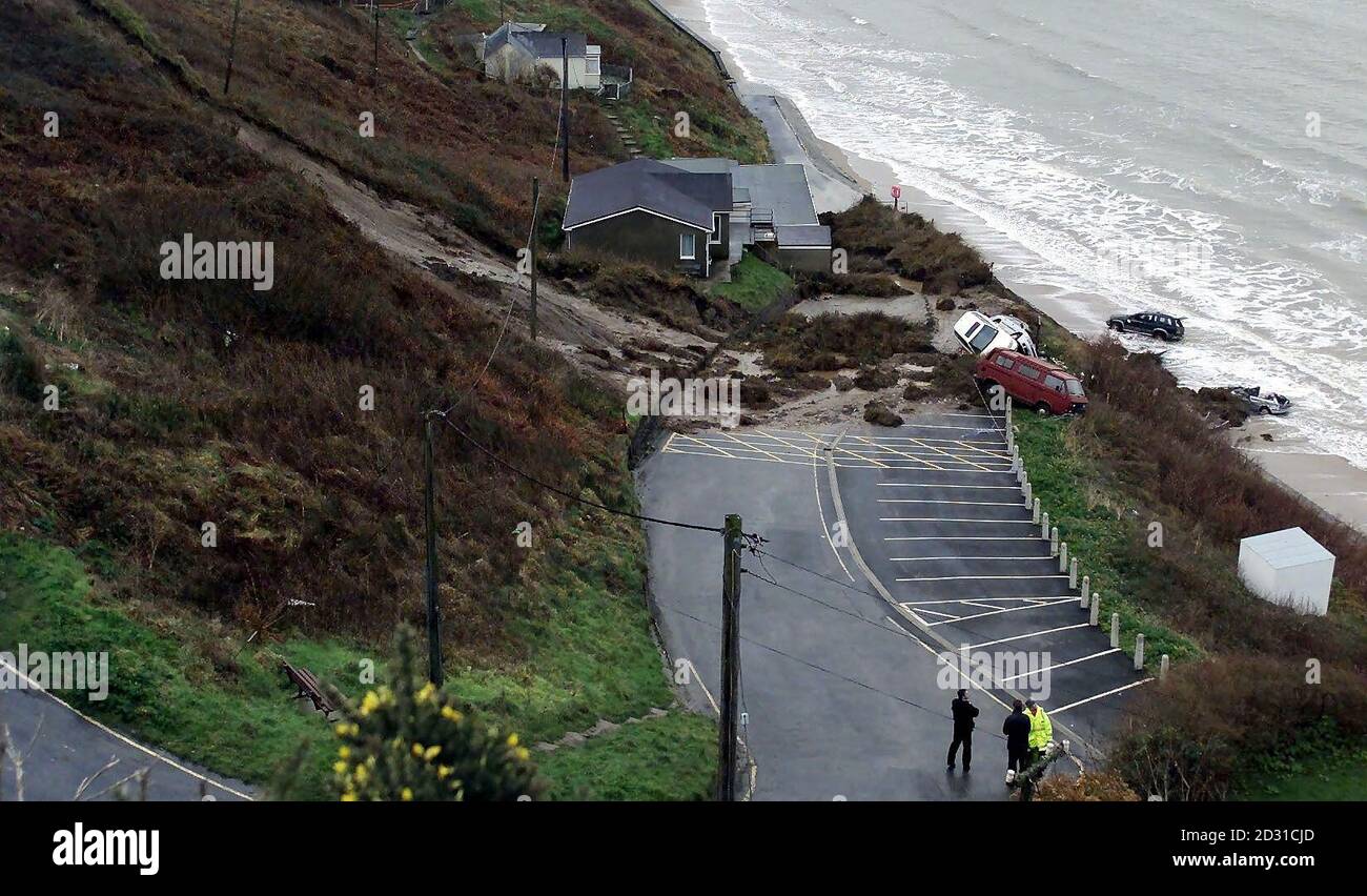 The scene of a landslide at Nefyn on the remote Lleyn peninsula in North Wales, in which a woman was killed and a man critically injured. Seven cars were believed to have been caught in the landslip.  *   with two of them were reported to have been swept at least 40ft down towards the sea and were left sticking out of the mud as emergency services launched a major rescue operation in the face of an incoming tide. The woman who died was recovered by a lifeboat but declared dead at the lifeboat base at nearby Porthdinllaen. Stock Photo