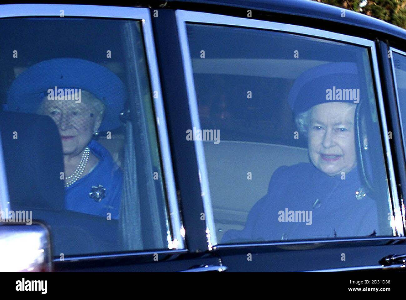 The British Queen (right) and the Queen Mother arrive at a church service which they attended with other members of the Royal Family at the St Mary Magdalene Church on the Sandringham Estate, Norfolk. . Stock Photo