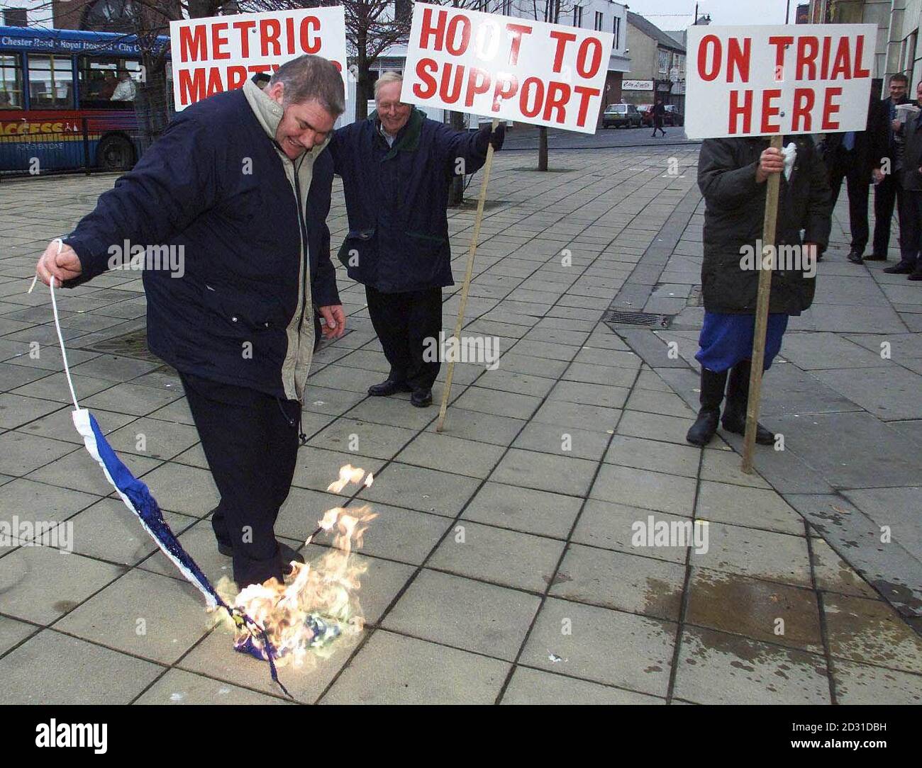 David Stephens, from Southend, shows his support for Steve Thoburn, a Sunderland market trader who is being prosecuted for selling goods in imperial measures rather than metric, by burning the flag of the European Union.  * Mr Stephens set fire to the flag outside Sunderland Magistrates Court, where Mr Thoburn is being prosecuted by Sunderland City Council. Stock Photo