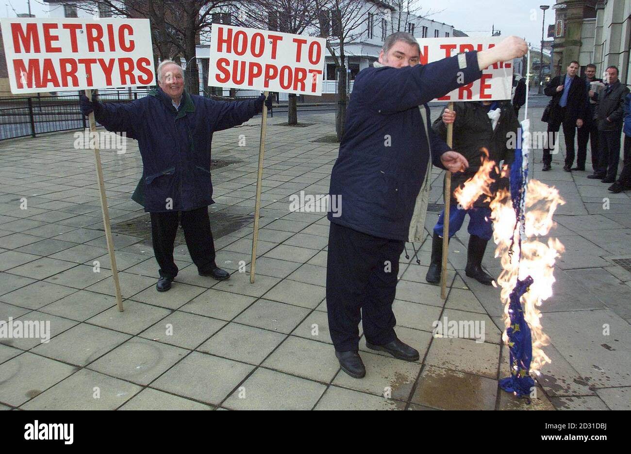 David Stephens, from Southend, shows his support for Steve Thoburn, a Sunderland market trader who is being prosecuted for selling goods in imperial measures rather than metric, by burning the flag of the European Union.  * Mr Stephens set fire to the flag outside Sunderland Magistrates Court, where Mr Thoburn is being prosecuted by Sunderland City Council. Stock Photo