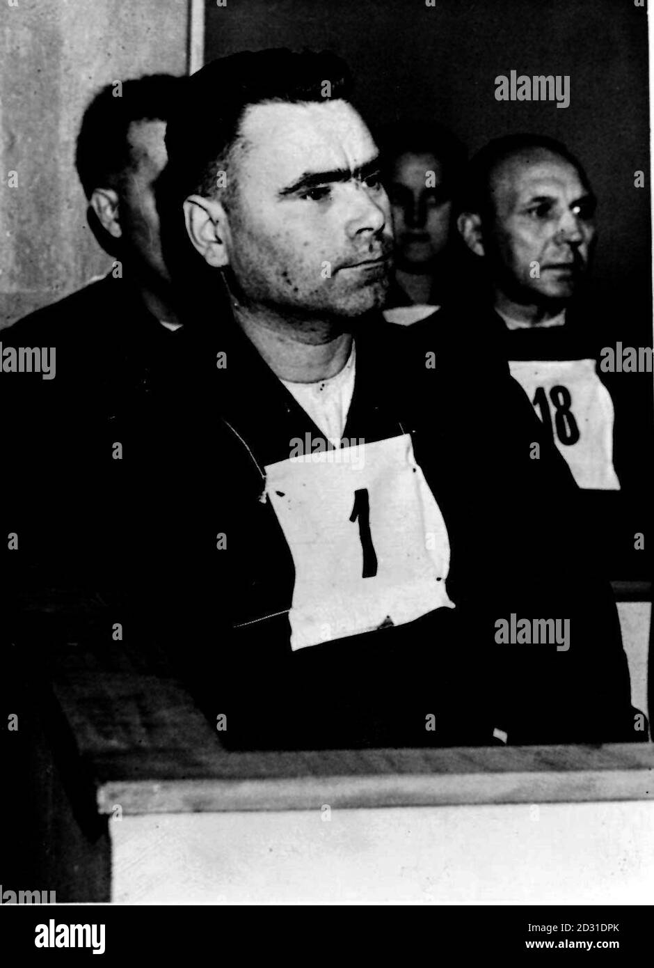1945:  Josef Kramer, known as 'The Beast of Belsen', in the dock during his trial at Luneberg, Germany, for crimes committed during his time as Commandant of Belsen concentration camp, near Hamburg. Kramer was sentenced to death on the 17th November 1945. Picture part of PA Second World War collection.  Stock Photo
