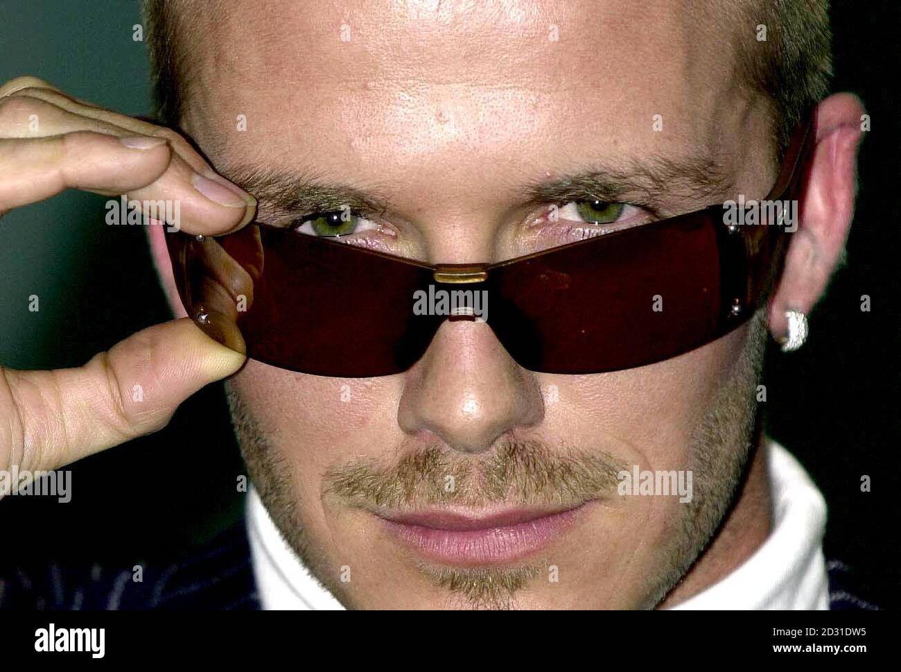 Manchester United and England footballer David Beckham wears the latest sunshade fashion from 'Police' sunglasses. Stock Photo