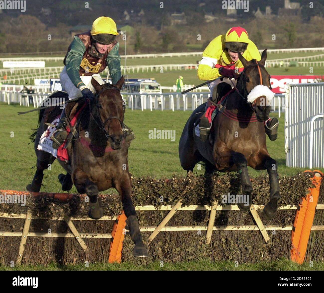 Lady Rebecca - ridden by Norman Williamson (left) comes through on the rail to beat Mister Banjo - ridden by Mick FitzGerald in the Byrne Bros Cleeve Hurdle at Cheltenham. Stock Photo