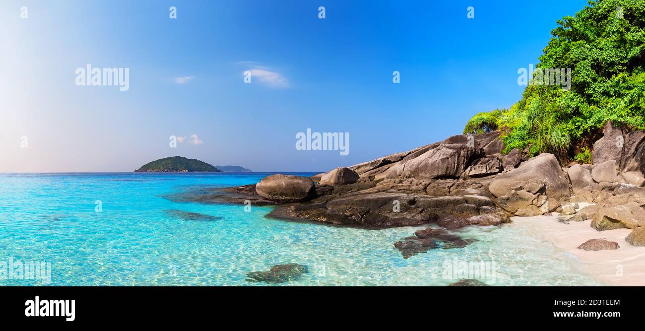 Beautiful beach and blue sky in Similan islands, Thailand. Vacation holidays background wallpaper. View of nice tropical beach. Panorama of travel sum Stock Photo