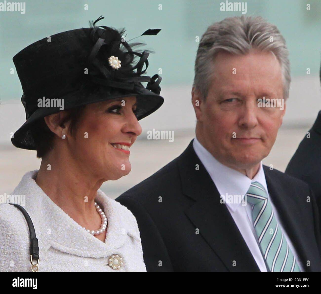 First Minister Peter Robinson and his wife Iris Robinson, wait for Queen  Elizabeth II and Duke of Edinburgh to arrive at the Titanic Centre in  Belfast, during a two-day visit to Northern