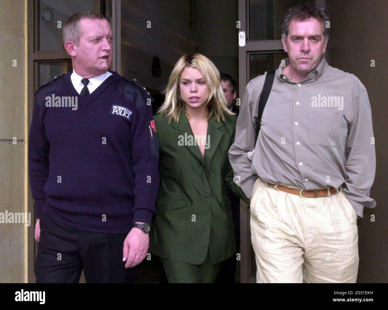 Pop star Billie Piper with father Paul, right, leaving Blackfriars Crown Court, London after giving evidence in the trial of Juliet Peters, 32, who is accused of having made five threats to kill the singer between August 14 and 25 2000.  *  and of four similar charges concerning the pop star's parents.  Stock Photo