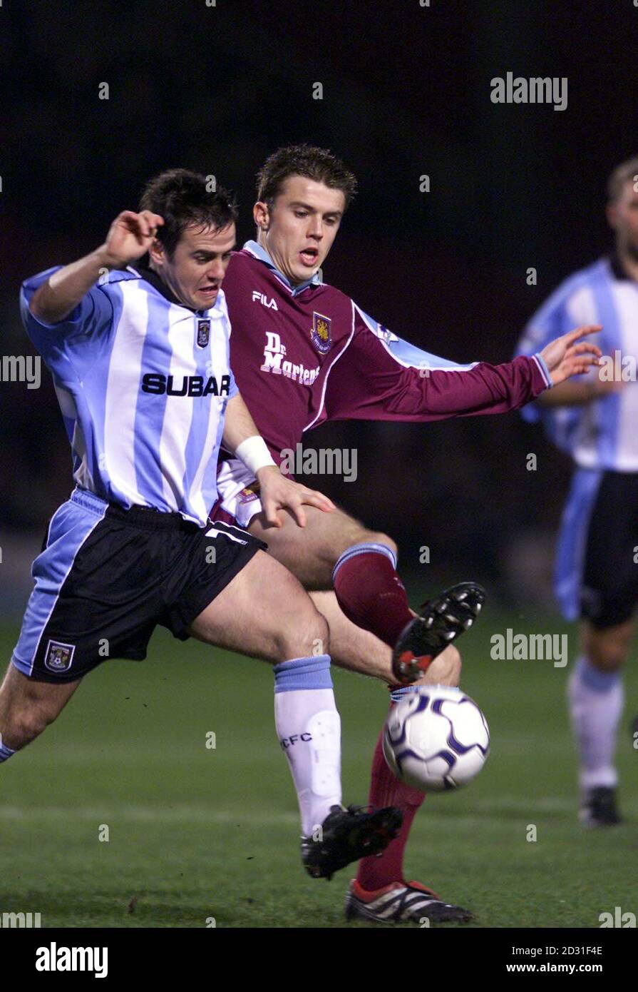 West Ham United's Michael Carrick, right, tussles with Coventry City's David Thompson during the Premiership game at Upton Park, London, Stock Photo
