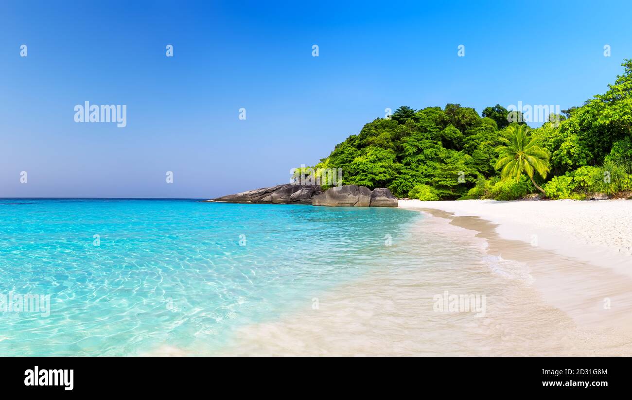 Beautiful beach and blue sky in Similan islands, Thailand. Vacation holidays background wallpaper. View of nice tropical beach. Panorama of travel sum Stock Photo