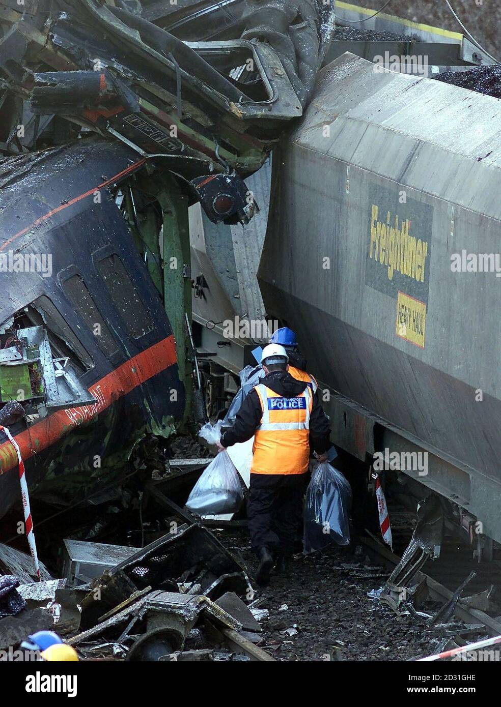 Police officers with personal possessions taken from the wreckage of the passenger train which was involved in a road and rail crash at Great Heck, near Selby in North Yorkshire, killing 13 people. Stock Photo