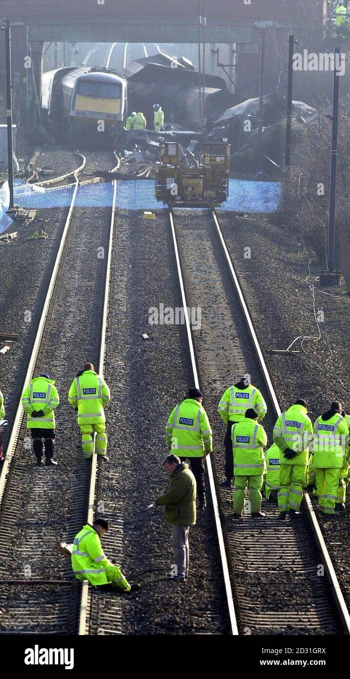 Police and emergency service workers hold a two minute silence at the site of the Selby Train Crash, when they suspended work on the recovery operation while a memorial service was held for those killed on 28/02/01, at the nearby St Paul's Church.  * ...in Hensall, Yorkshire. Stock Photo