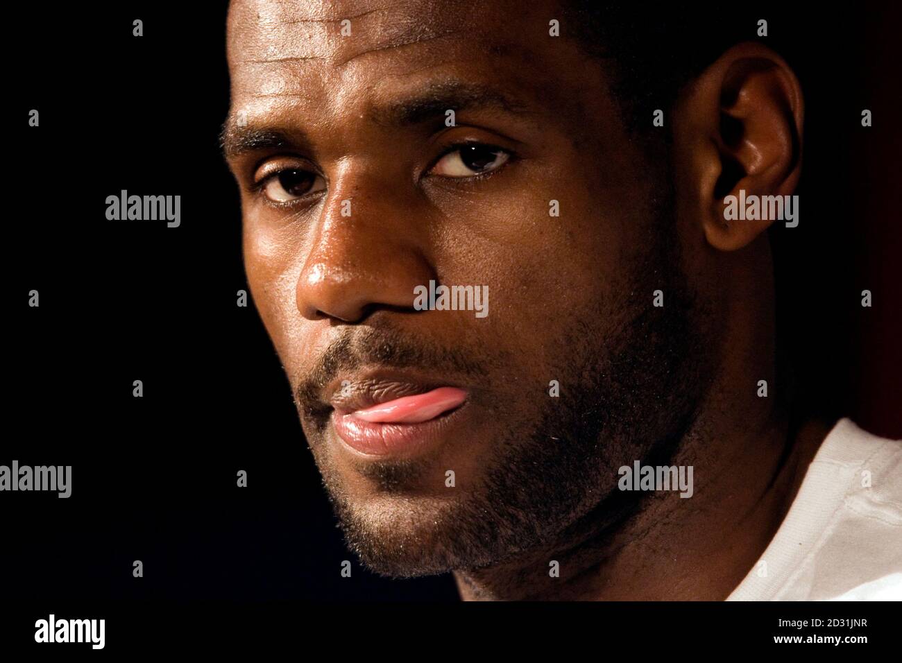 Basketball player LeBron James of U.S. team Cleveland Cavaliers answers  reporters during a promotional event in Paris September 1, 2009. James is  in France on a worldwide tour to promote a new