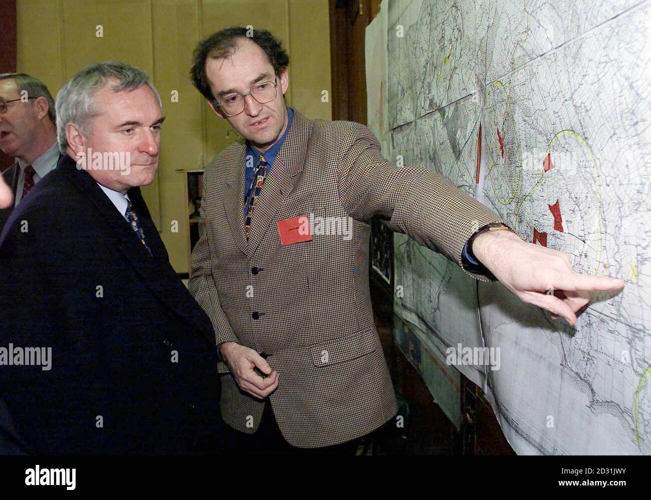 John Griffin, a Vetenery Epidemiologist with the Department of Agriculture, showing Irish Prime Minister Bertie Ahern (L) a map of the Colley Peninsula Co. Louth, during his visit to the area where the only case of foot-and-mouth disease is in the Republic. * The results for suspected cases in Co. Wexford and Co. Louth both proved negative. Stock Photo