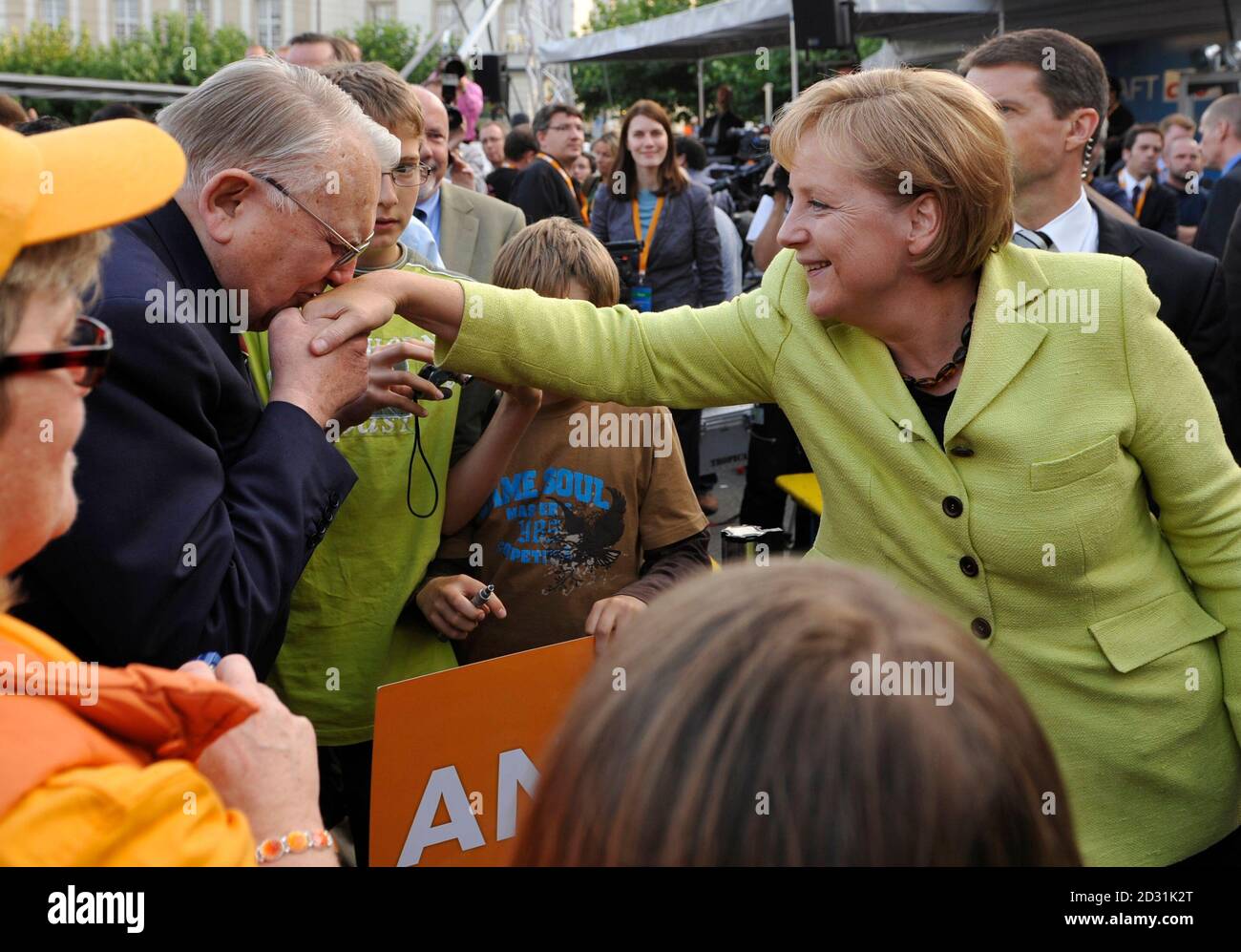 German Chancellor Angela Merkel receives a hand kiss from a supporter  following an election campaign rally in Kassel September 21, 2009. Merkel,  the leader of the conservative Christian Democratic Union (CDU) party,