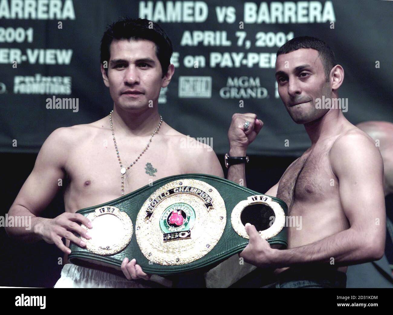 Mexican Marco Antonia Barrera (L) holds the IBO Featherweight belt with