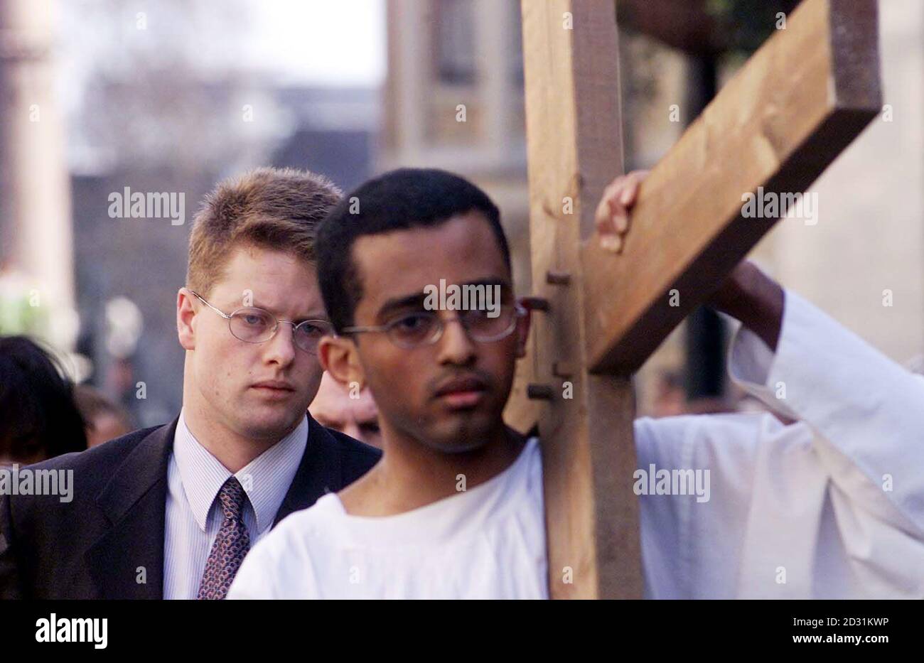 28-year-old human rights campaigner James Mawdsley (left) freed in October from a Burmese prison after serving 14 months of a 17-year prison sentence for distributing pro-democracy leaflets, at a Good Friday re-enactment of Christ's crucifixion.  *... with A-level student Yohannes Hailelul, 18, from St Charles Catholic Sixth Form College, west London. It is the 10th year the ecumenical ceremony has taken place and was raising money for The Passage, a homelessness shelter, and Jubilee Campaign, a human rights organisation which has worked with Mr Mawdsley.  Stock Photo