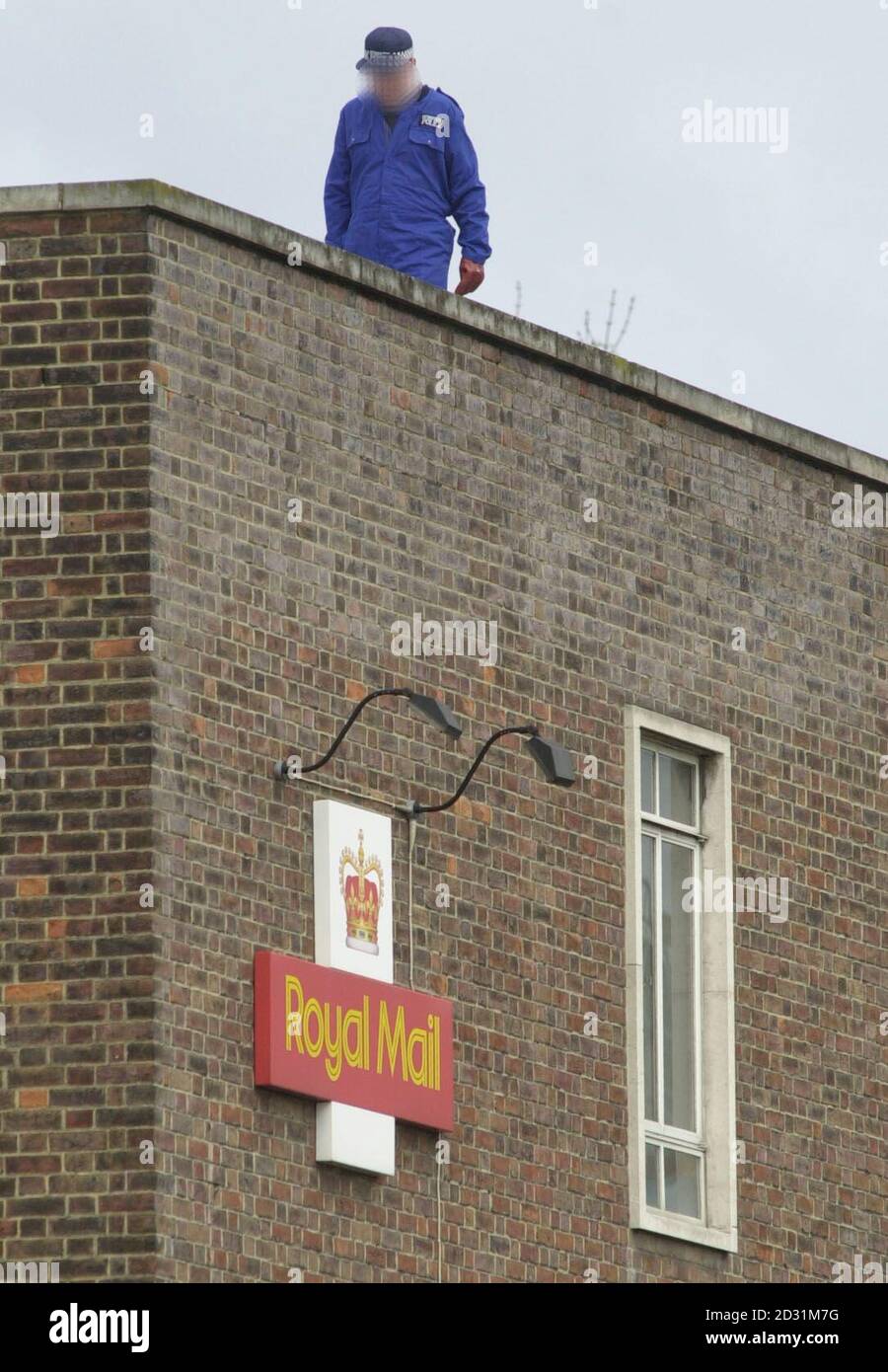 Police search the roof of the post office sorting depot in Hendon, north  west London, early Sunday 15th April 2001, where a bomb exploded late  14/04/01 Stock Photo - Alamy