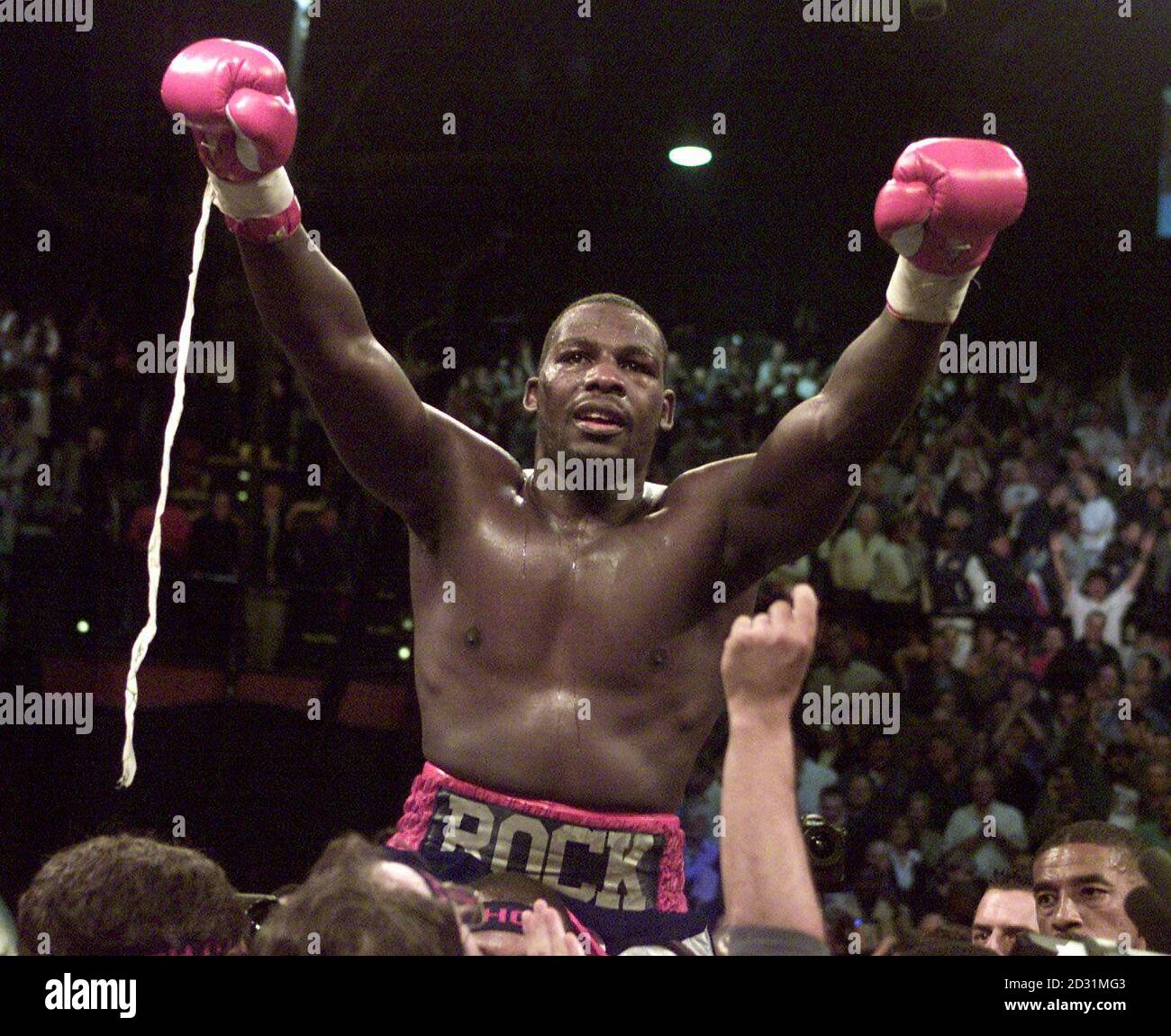 Hasim Rahman is held high above the ring by his corner men during the World Heavyweight Title fight at Carnival City, Johannesburg. Rahman knocked out Britain's Lennox Lewis in the fifth round to become the new WBC/IBF/IBO Heavyweight Champion. * R/I: 25/04/01. 18/11/01: Britain's Lennox Lewis knocked out American Hasim Rahman in the fourth round in a rematch at Mandalay Bay Hotel, Las Vegas, USA. Stock Photo