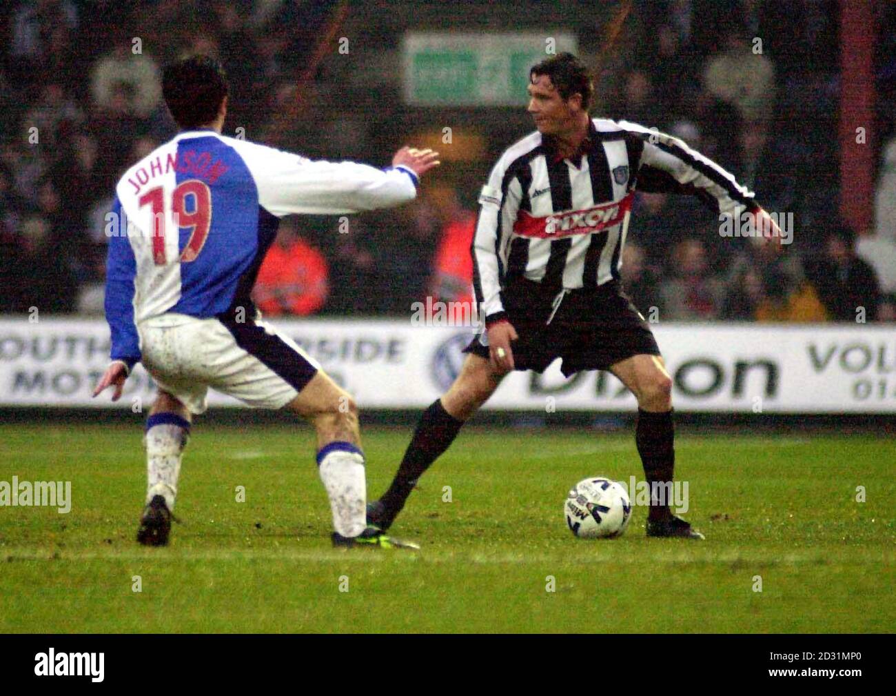 Grimsby Town's Tony Gallimore (right) looking to pass, as Blackburn Rover's Damien Johnson runs towards him, during the Nationwide Division One game at Blundell Park, Grimsby. Stock Photo