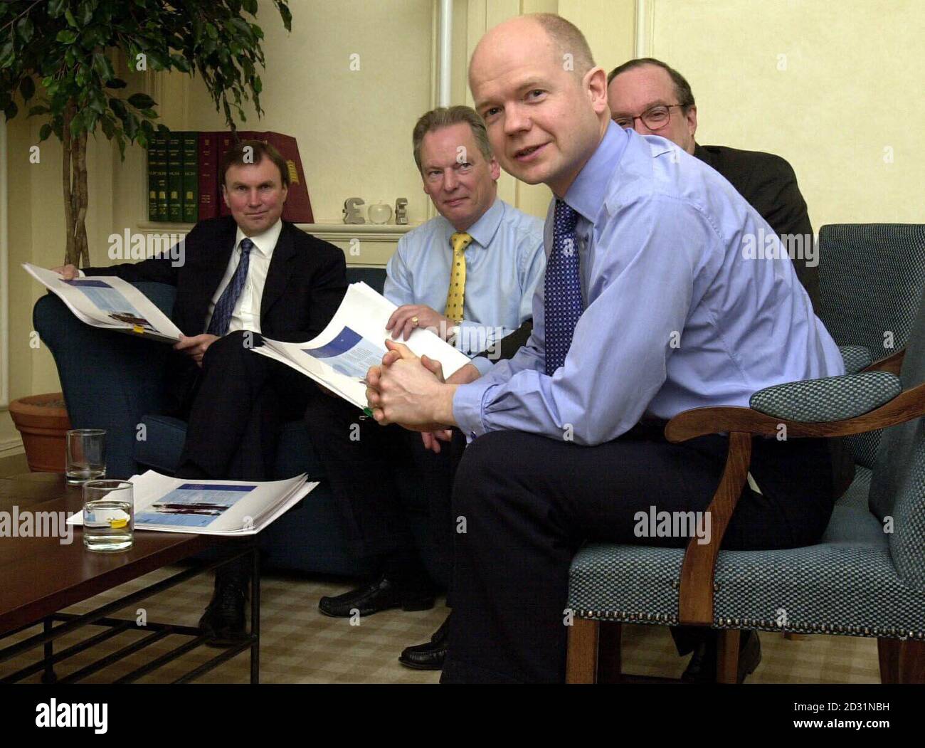 Tory leader William Hague (front) discussing the party's election