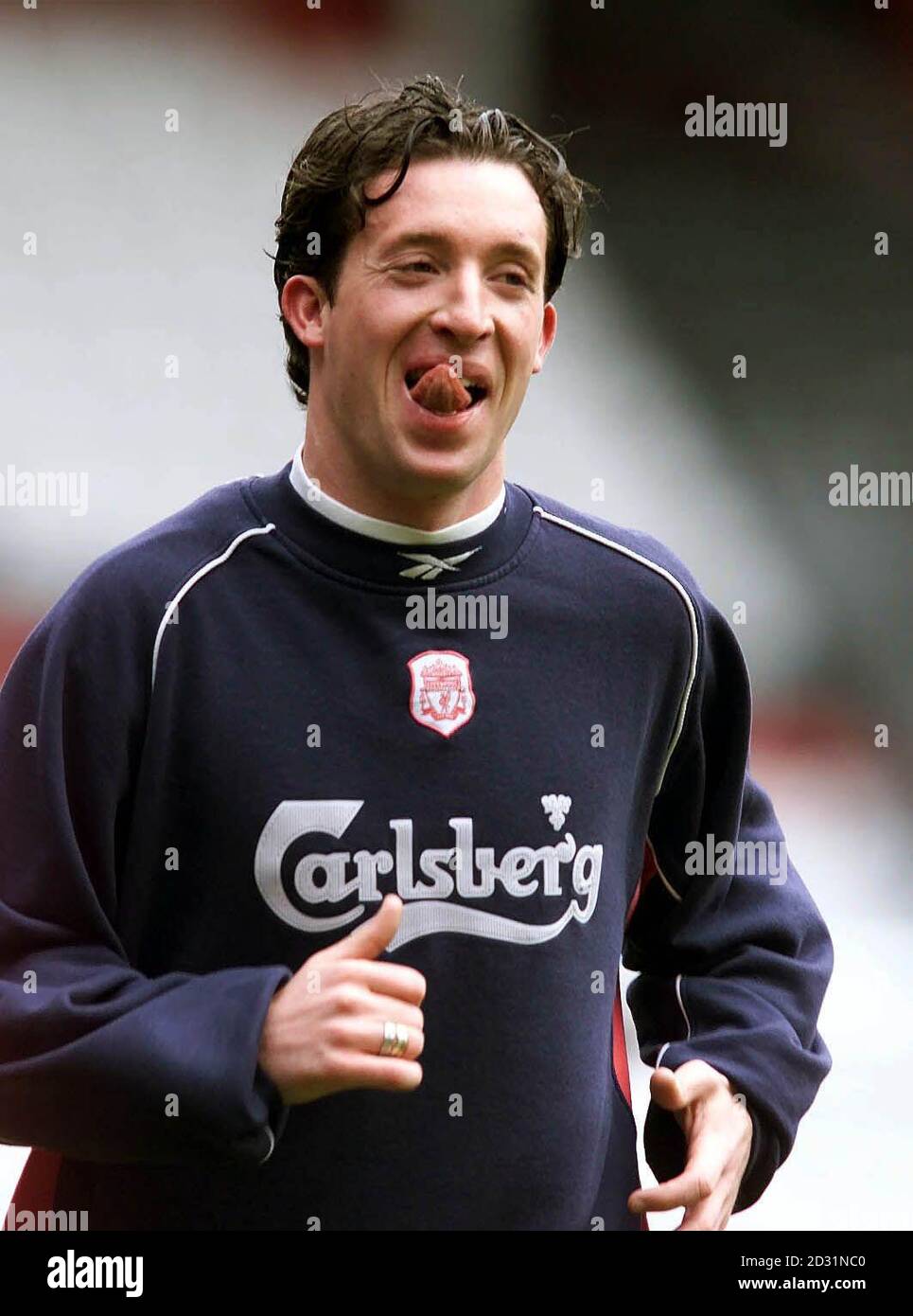 Liverpool striker Robbie Fowler jogs during an open training session at Anfield, Liverpool today Thursday 3rd May 2001, ahead of their two Cup Finals this month. Liverpool play Arsenal in the FA Cup Final on the 12th May , and then take on CD Alaves in the UEFA Cup Final  on the 16th May.  9/6/01: Fowler is marrying his long-term girlfriend in a luxurious 14th century castle. The 27-year-old will wed Kerrie Ann Hannon, 23, in Duns Stock Photo