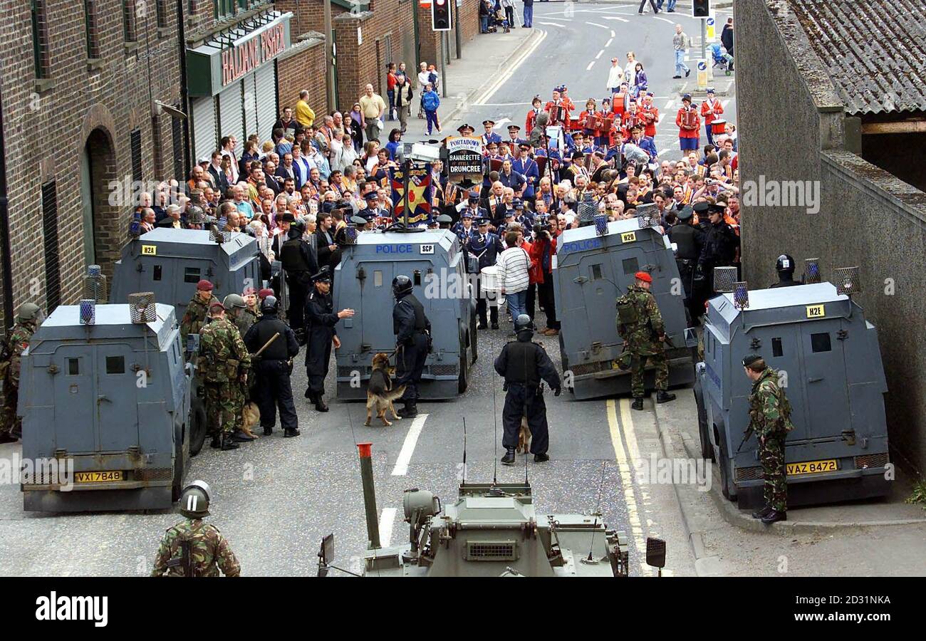 Security forces seal off the bottom of the Garvaghy Road, in Portadown, to stop members of the Portadown Orangemen from entering a nationalist area. They were marching to mark the 1000th day of the Drumcree Protest.  Stock Photo