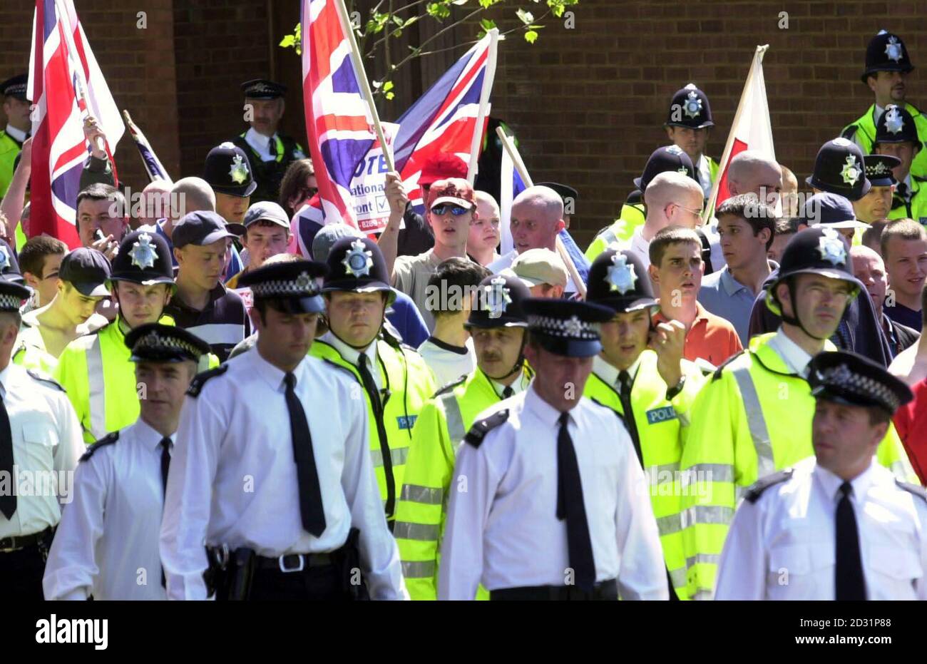 The National Front holding its third march this year through the streets of Bermondsey, London amid a strong police presence. The marches have angered community leaders who believe that the National Front is trying to stir up racial tension in the area. Stock Photo