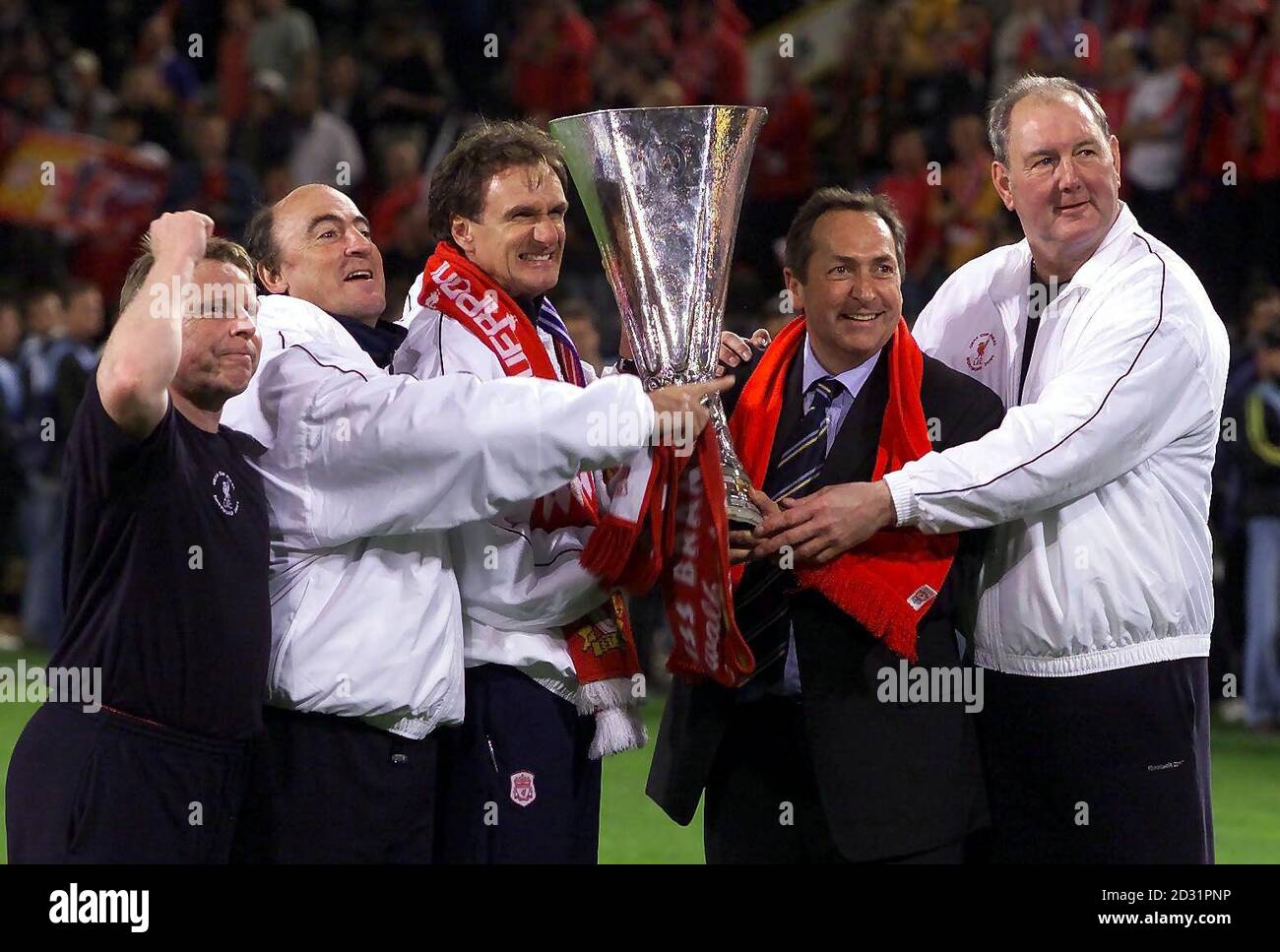 Liverpool's management team pose with the UEFA Cup Final at the Westfalen Stadium, Dortmund. Stock Photo