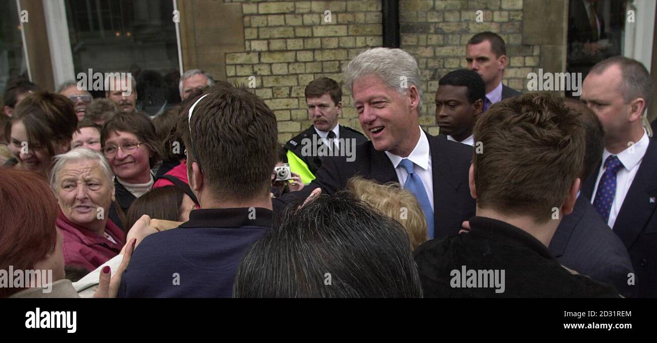Former American President Bill Clinton greets wellwishers as he leaves the Randolph Hotel in Oxford.  Later in the day Mr Clinton, who studied politics at University College as a Rhodes Scholar was due to officially open the Rothermere American Institute.   Stock Photo