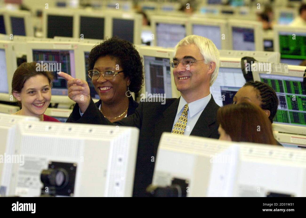Morgan Stanley New Deal participants (from left) Yasmin Awan, Vicki  Manyo-Plange, Stephanie Lee and Laura McKay with new Work and Pensions  Secretary Alistair Darling (pointing) on the trading floor at City firm