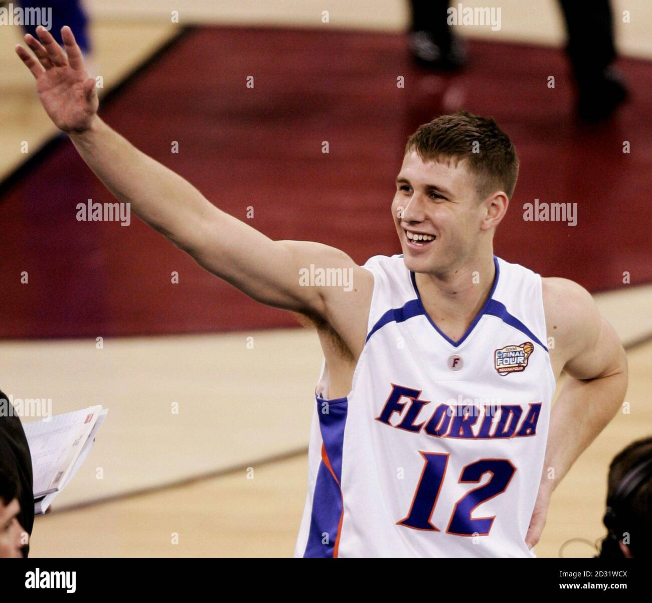 Florida Gators' Lee Humphrey waves to the crowd as he celebrates his team's  73-58 win over the George Mason Patriots in their semi-final basketball  game at the men's NCAA Final Four in
